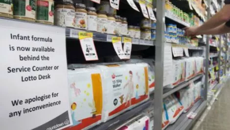 NZ dollar drops after threats to contaminate dairy products revealed